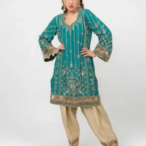 Teal ethnic dress with gold floral embroidery and matching pants, CoutureCraze 2025.
