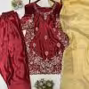 Sleeve close-up: Intricate gold floral embroidery detail on maroon ethnic dress sleeve.