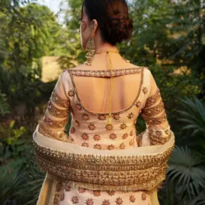CoutureCraze blush pink gold embroidered lehenga set with star motifs and heavy threadwork