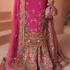 Closeup of golden embroidery detail on magenta CoutureCraze sharara set sleeves