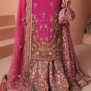 Closeup of golden embroidery detail on magenta CoutureCraze sharara set sleeves