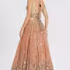 Peach net lehenga with mirror and thread embroidery, styled for wedding wear by Couturecraze