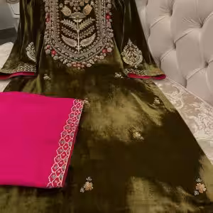 Olive green velvet suit with hand embroidered French velvet shirt, raw silk trousers and organza dupatta