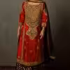 Red silk embroidered kurta set styled for Indian wedding